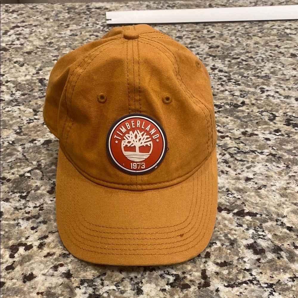tan-colored Timberland 1973 baseball cap